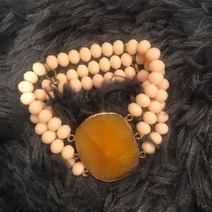Great fall triple bracelet with apricot stone center.